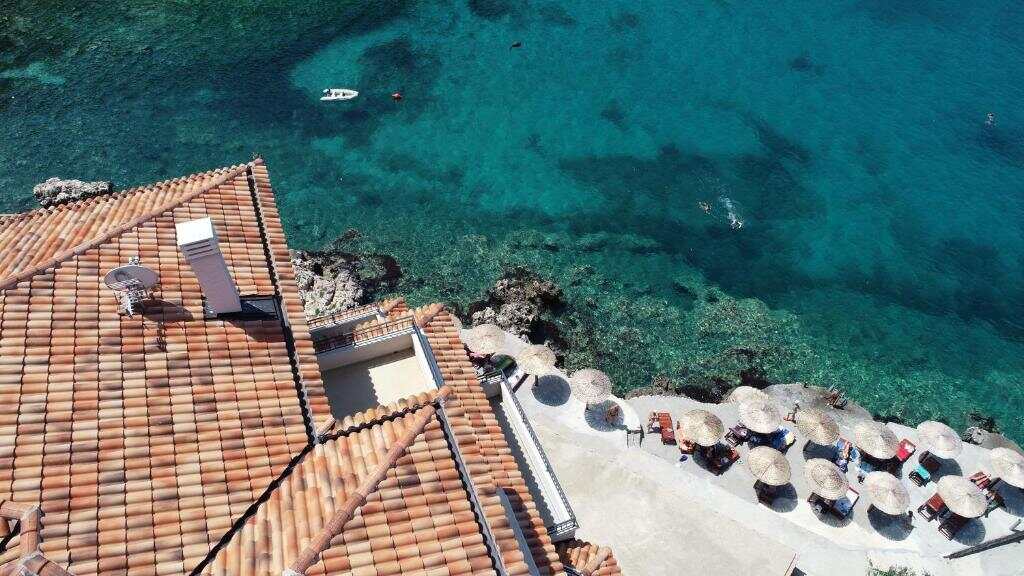 Private beach area beside the crystal-clear sea at Regina del Mare